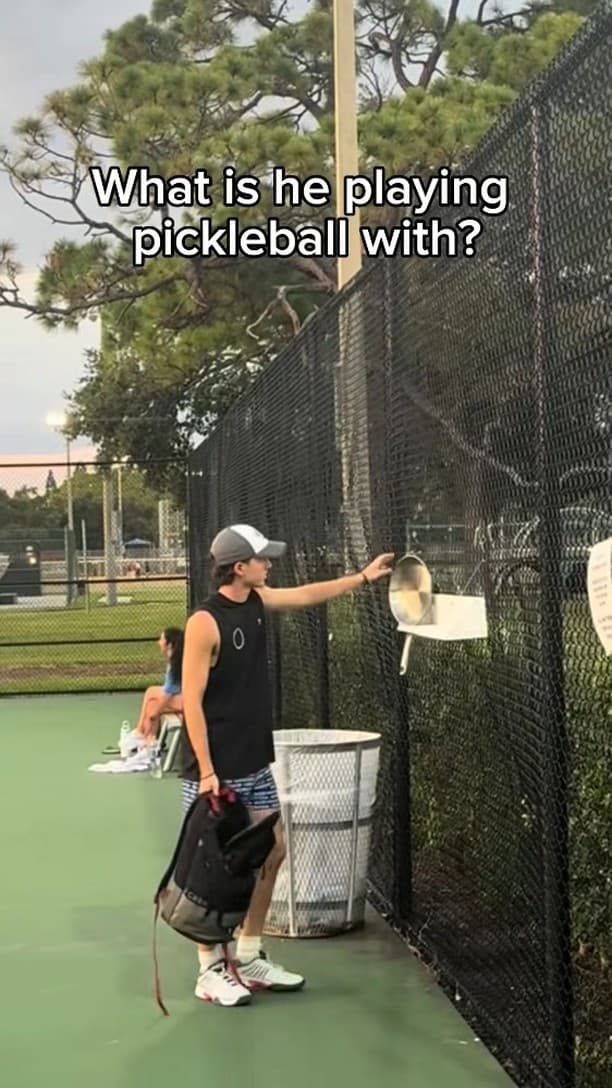 What is he playing pickleball with?