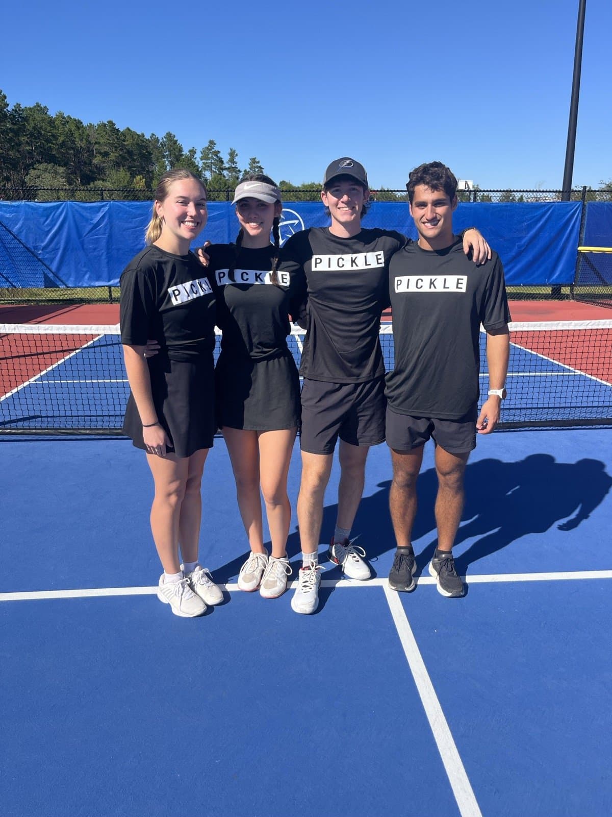 The Nasty Pickle crew in PICKLE shirts after a tournament
